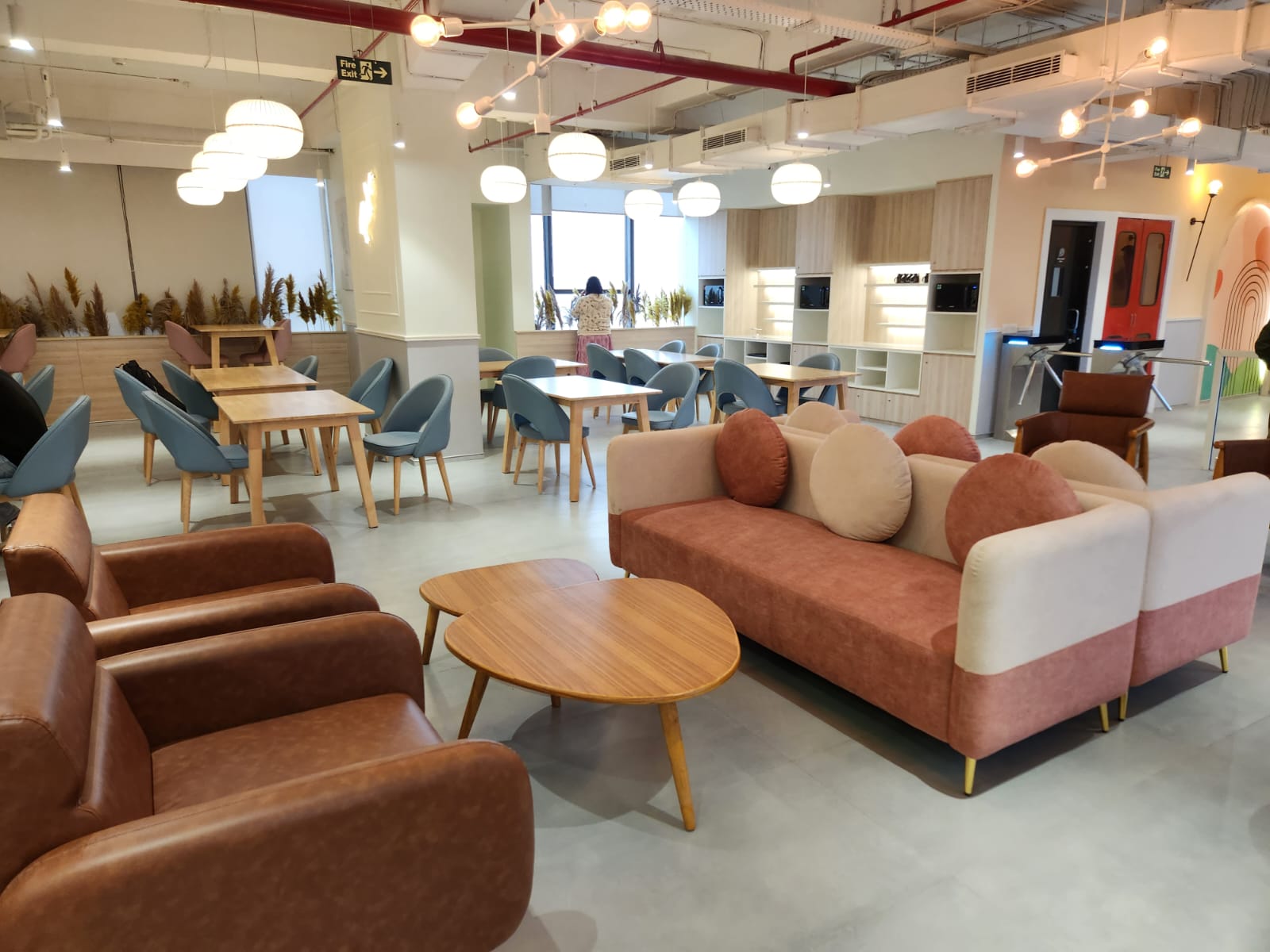 Breakout seating area at MAGICX overlooking the cafeteria and entrance gates